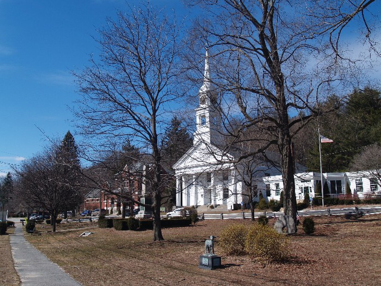 The town common in Sterling center with trees, a white church and historic buildings