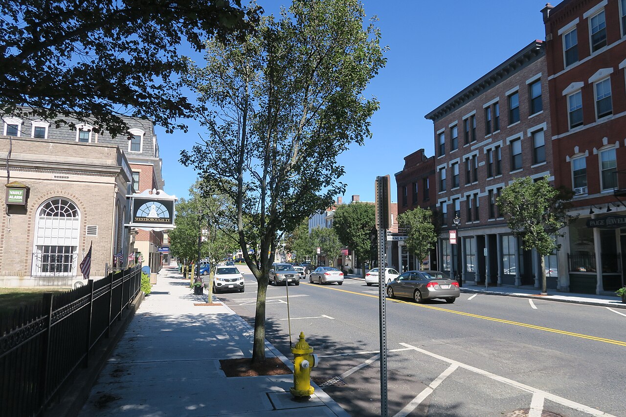 Brick commercial blocks and street trees along West Main Street in Westborough on a sunny day